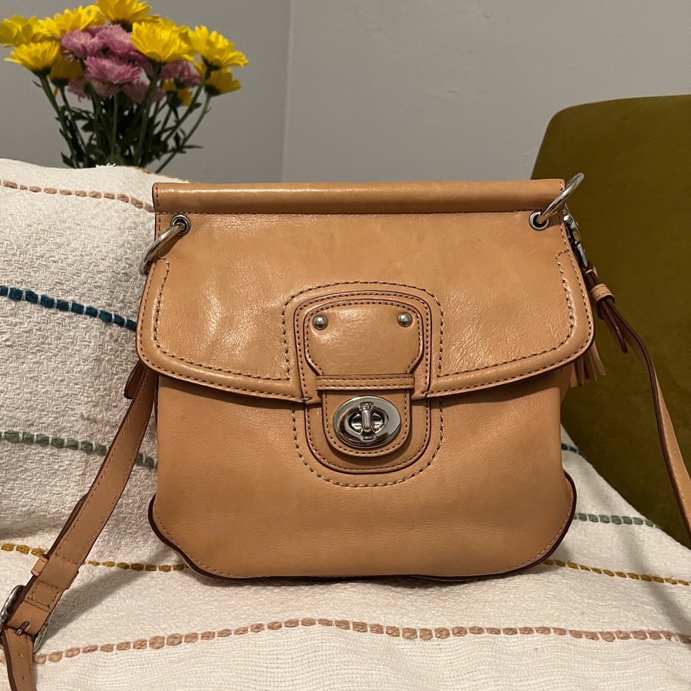 Tan Coach leather handbag.